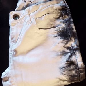 White jeans with Black tie dye down the side.